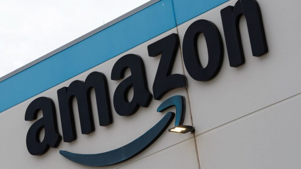 An Amazon company logo affixed to the exterior of a building.