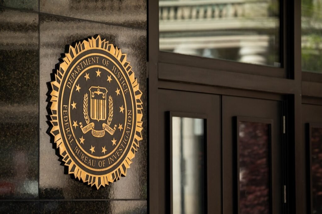The Department of Justice (DOJ) seal on the J. Edgar Hoover Federal Bureau of Investigation (FBI) building in Washington, DC.