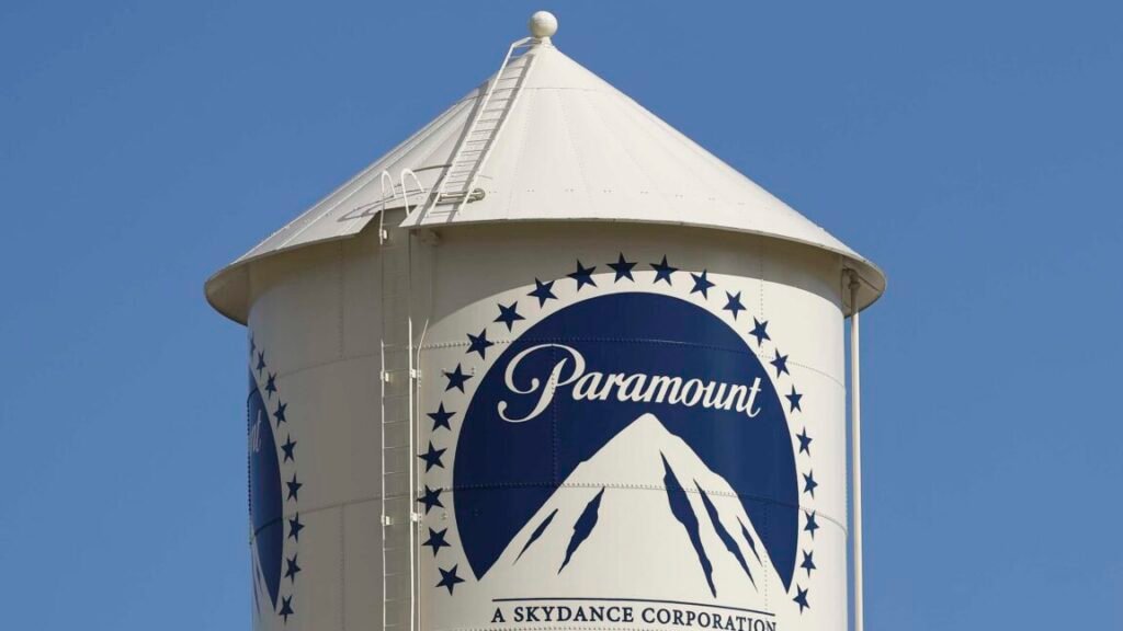A water tower with the Paramount logo painted on its side.