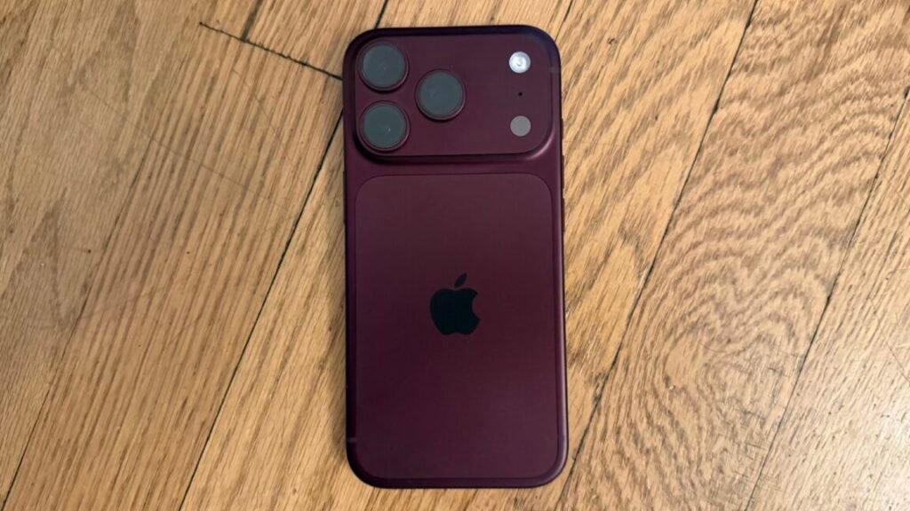 An iPhone on a wood surface