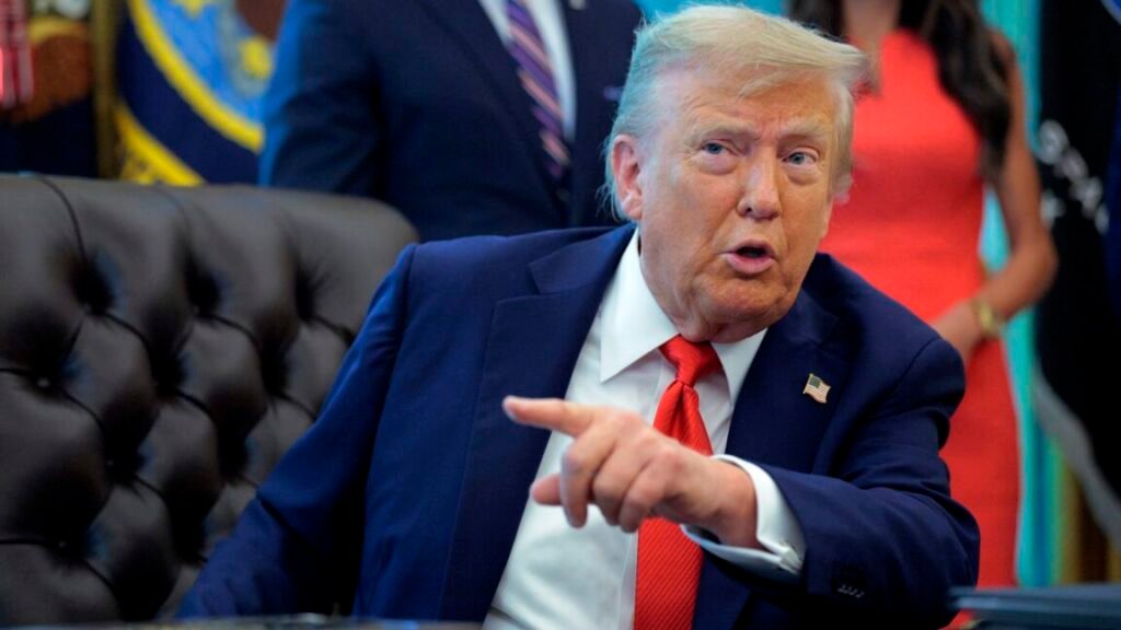 Trump rejects AI slowdown calls, launches "AI Force" instead President Donald Trump sits at his desk and talks while pointing a finger.