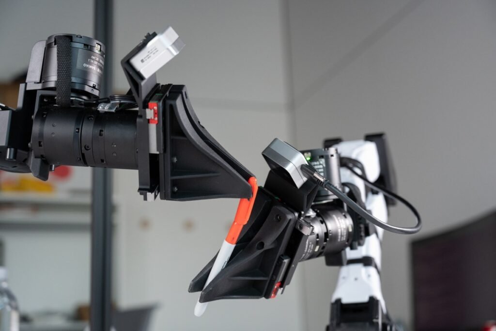 XDOF, just three months out of stealth, is in talks for a Series B at a $1.2B valuation XDOF's robotic arms manipulate a pen and cap.
