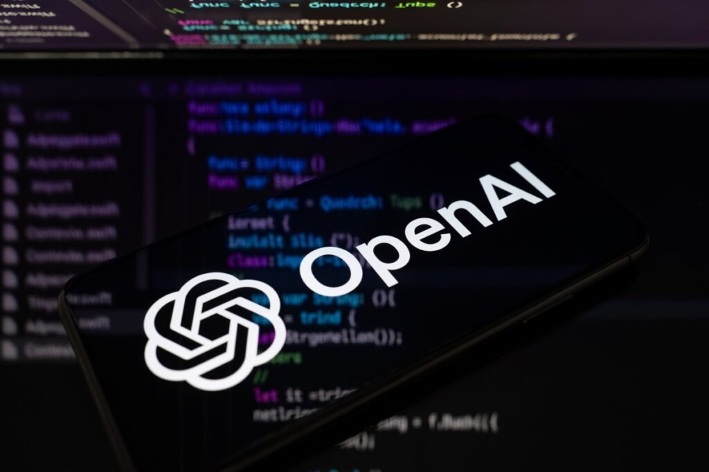OpenAI safety employee resigns, claiming the company’s ‘culture is broken’ The OpenAI logo is displayed on a smartphone screen placed on a reflective surface onto which lines of computer code.
