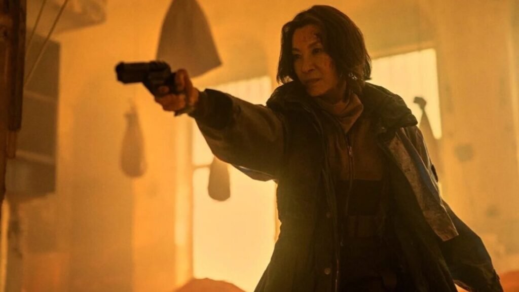 Asian woman in trench coat pointing a gun