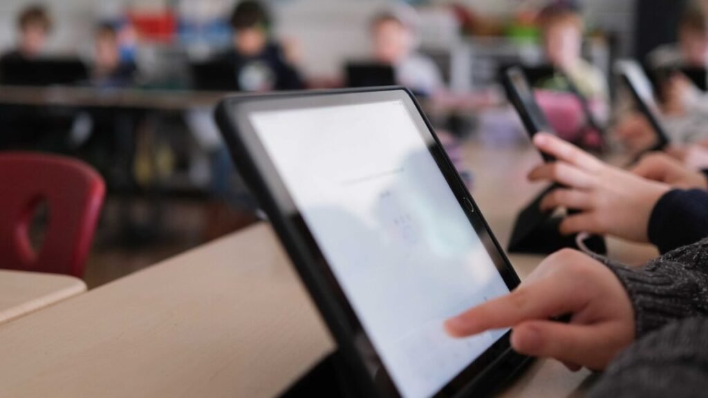 Kids using tablets in a classroom